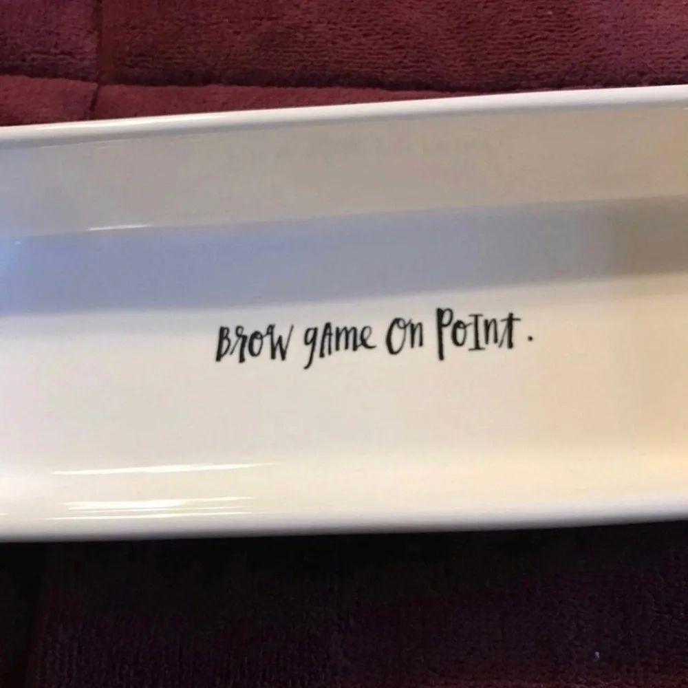 Rae Dunn Ceramic Makeup Tray “brow game on point”.